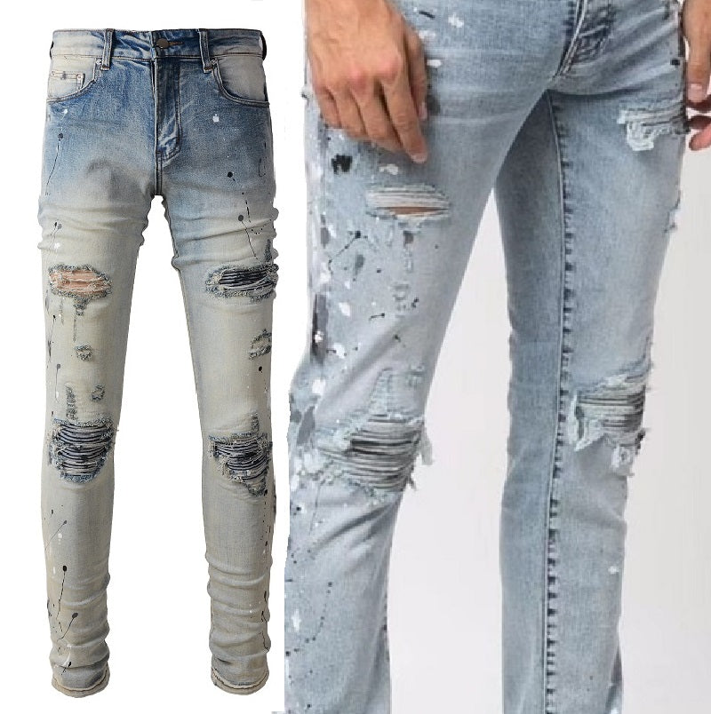 Pintura de color claro salpicando jeans lavados viejos para hombres