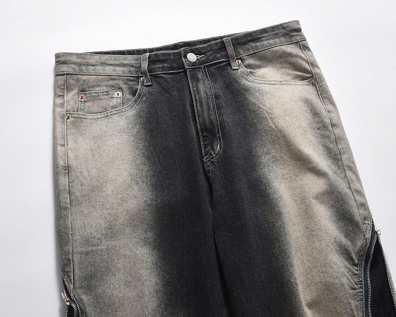 Jeans acampanados con pernera ancha y lavado degradado con patchwork y cremallera