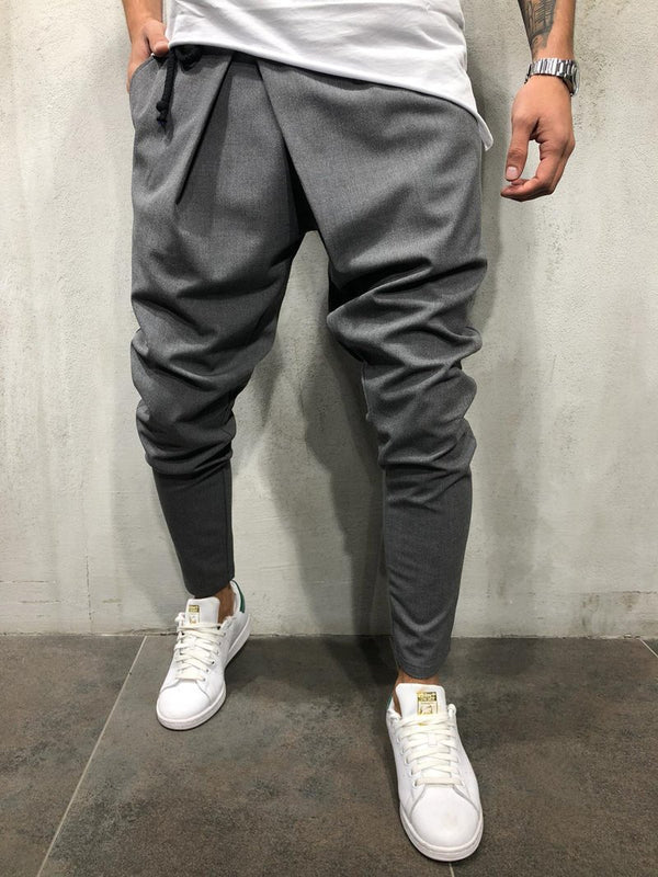 Pantalones casuales asimétricos con cordón en la cintura y pies pequeños para hombre