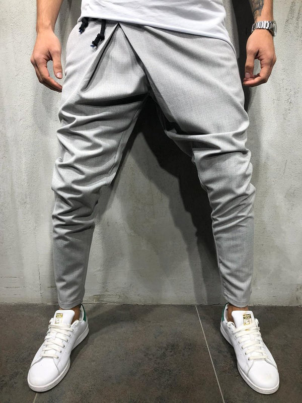 Pantalones casuales asimétricos con cordón en la cintura y pies pequeños para hombre